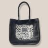 Cartera Tote Lirio cuero negro con panel pelo de vaca manchas, Rose Blanche