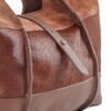 cartera-clarisse-gamuza-pelo-vaca-cuero-chocolate-detalle-lateral-texturas-rose-blanche.jpg Detalle lateral Cartera Clarisse Rose Blanche, combinación de pelo de vaca y cuero vacuno chocolate con tira central, artesanal Patagonia